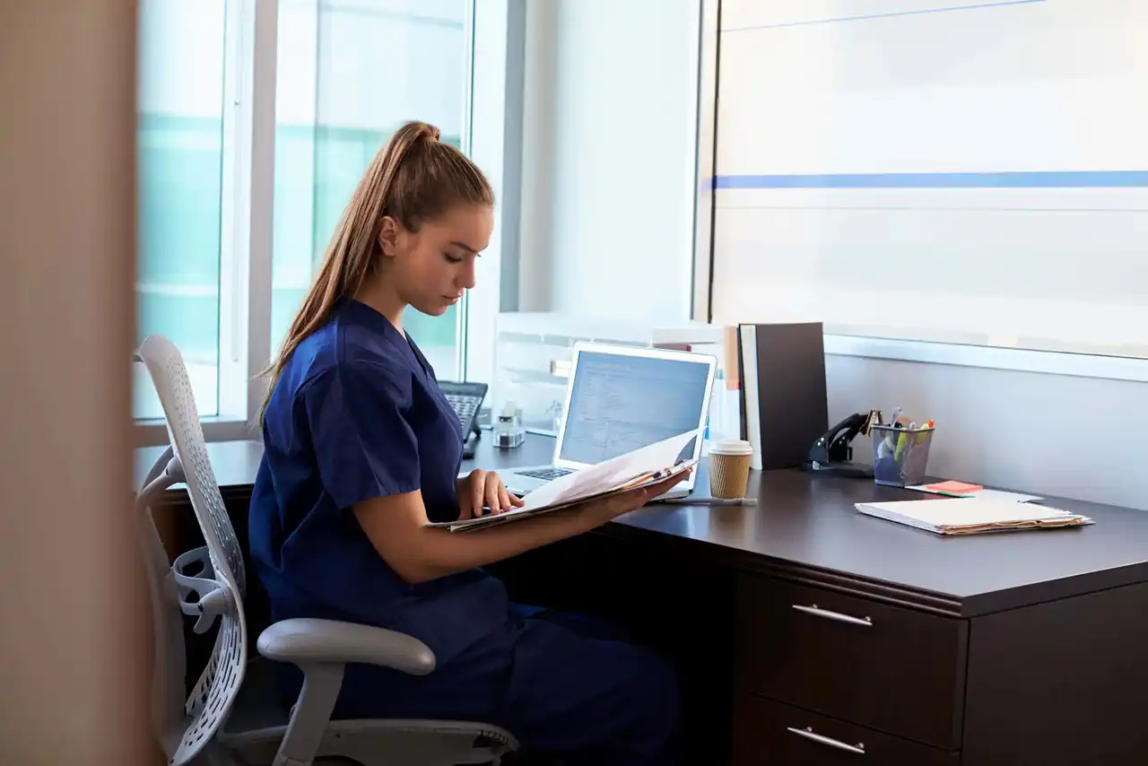 doctor reading on computer a newsletter